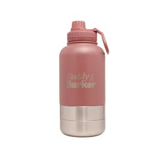 Pink dog water bottle with silver bowls on a white background