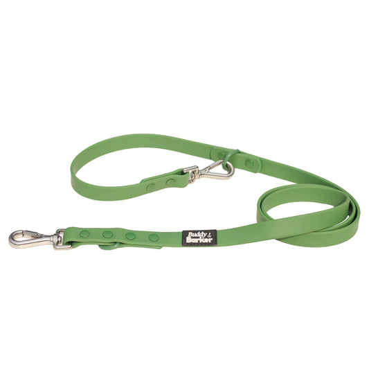 Green dog leash with a silver clip on a white background