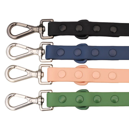 Four dog leashes in black, blue, pink, and green with 'Buddy & Barker' branding.
